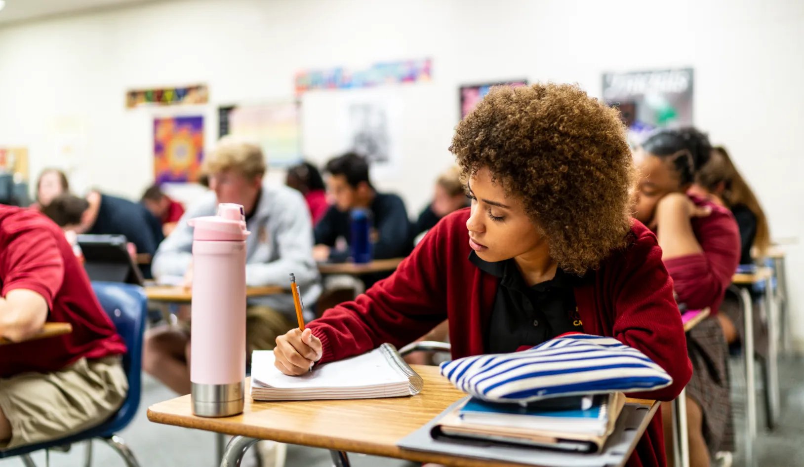 Student writing notes at Roncalli Catholic High School in Omaha, Nebraska