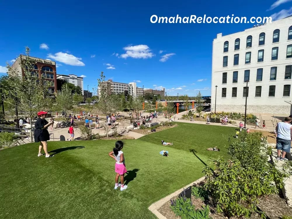 Green space where kids roll down a small incline. 