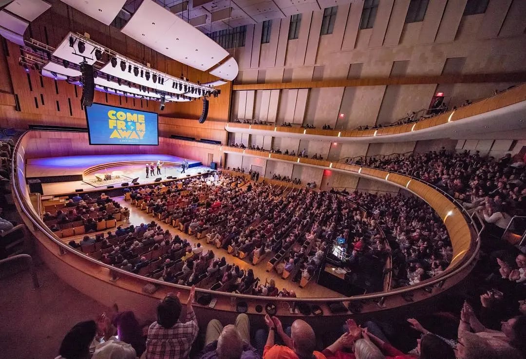 Crowd of people in the Holland concert hall watching a performance.