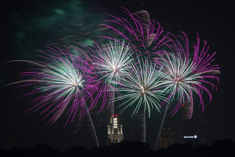 Purple and green fireworks over Memorial Park.