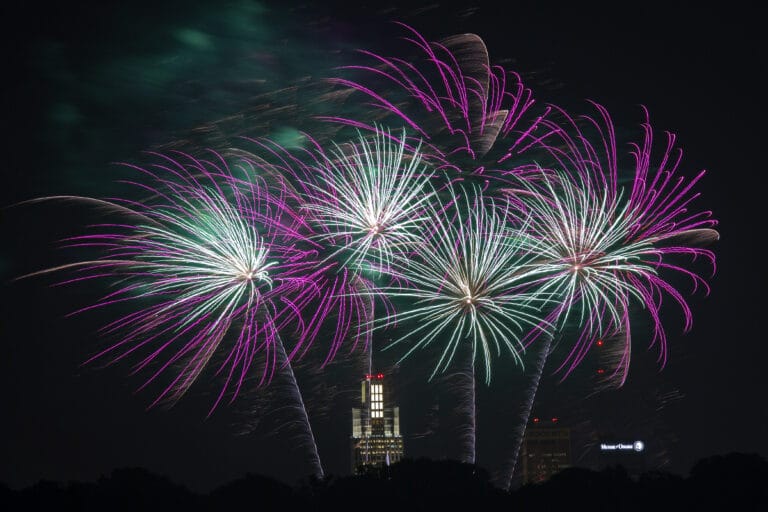 Purple and green fireworks over Memorial Park.
