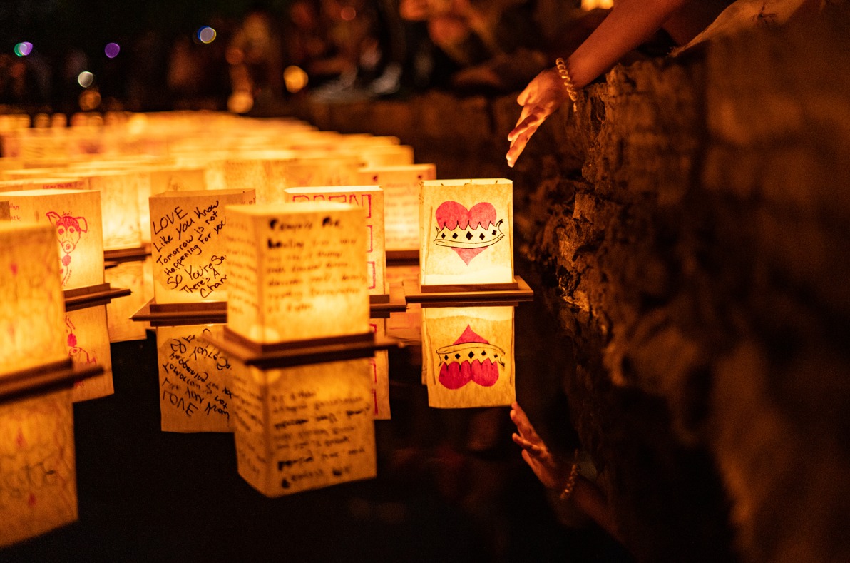 Laterns floating on a lake at the Water Lantern Festival.