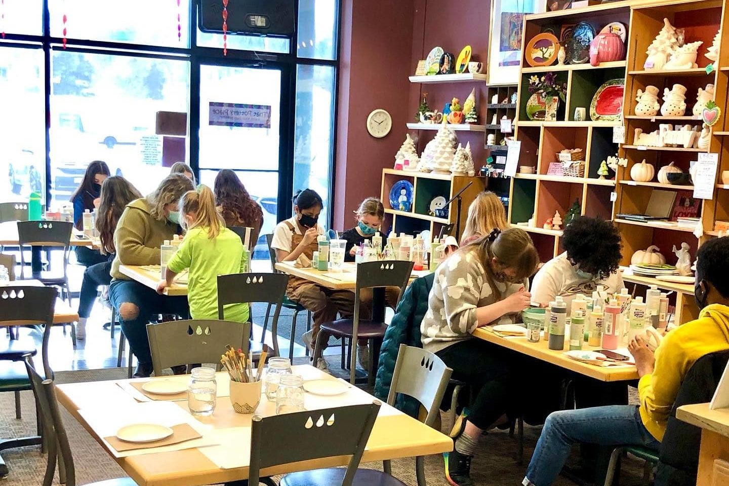 Kids glazing pottery at That Pottery Place. 