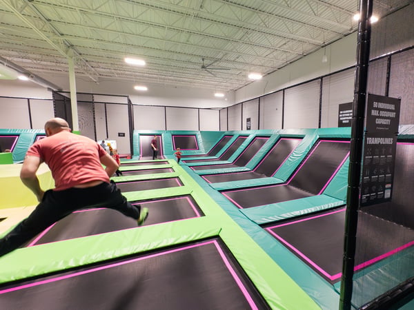 Man bouncing on trampoline.