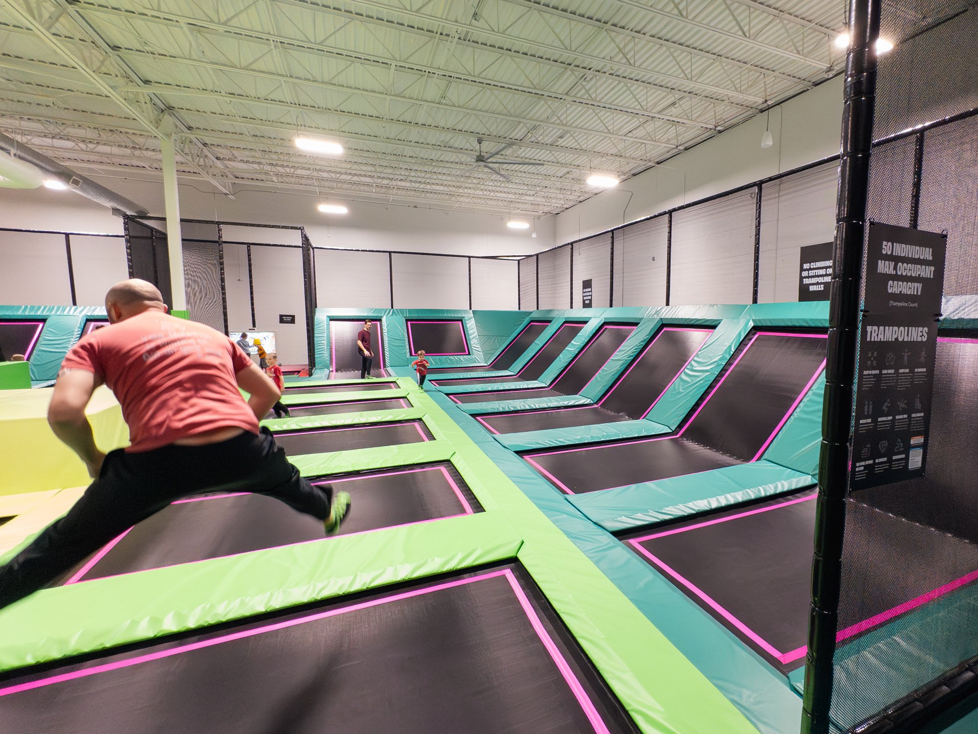 Man bouncing on trampoline.
