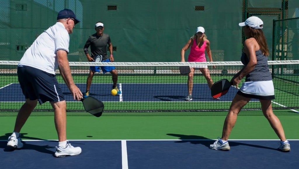 men and women playing pickleball at Maple Athletic Complex